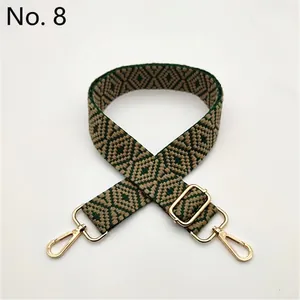 Adjustable dark green and gold geometric woven bag strap with gold metal buckles