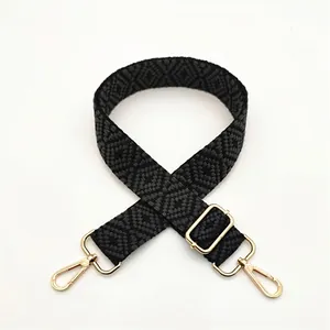 Detailed view of woven geometric diamond pattern replacement strap with gold metal hooks