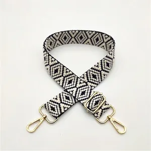 Detail of Style 14 black and white woven strap with golden metal lobster clasps