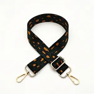 Adjustable leopard print bag strap in green and orange with gold metal swivel hooks
