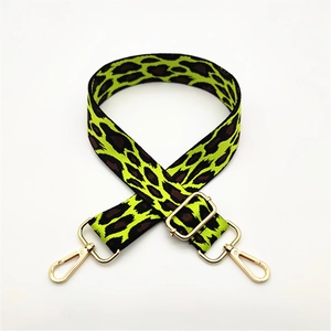Adjustable leopard print bag strap in green and black with gold metal hooks