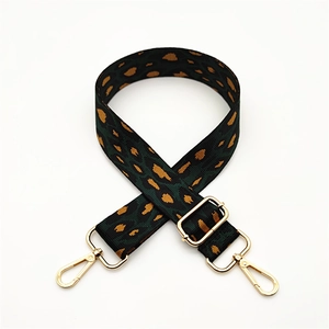 Adjustable leopard print wide shoulder strap with green and orange pattern and gold hooks