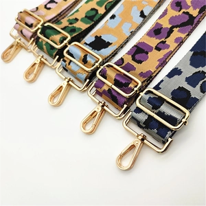 Close-up of colorful leopard print adjustable shoulder straps with gold hardware