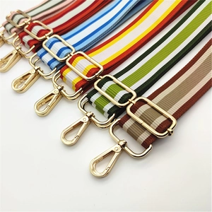 Adjustable woven shoulder straps with colorful stripes and gold metal lobster clasps