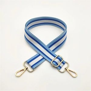 Adjustable blue and white striped canvas bag strap with gold metal lobster clasps