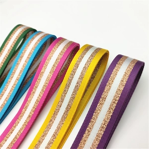 Detail of colorful woven shoulder straps featuring metallic gold and silver stripe texture