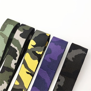 Detailed macro view of four camouflage pattern weaving textures on wide bag straps