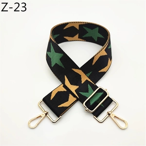 Adjustable woven guitar strap for bags with green and yellow stars and gold hardware