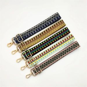 Five adjustable woven shoulder straps with colorful patterns and gold metal buckles