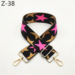 Detail of Z-38 black wide strap with pink star pattern and gold lobster clasp