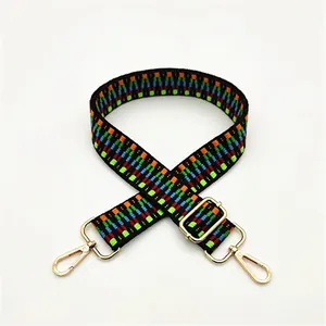 Close-up of woven bag strap No. 51 with ethnic wave patterns and gold metal buckles
