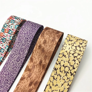 Detail showing four assorted leopard and floral patterns on wide adjustable bag straps