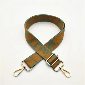 Bandoulière réglable tissée en vert olive et caramel avec des crochets dorés