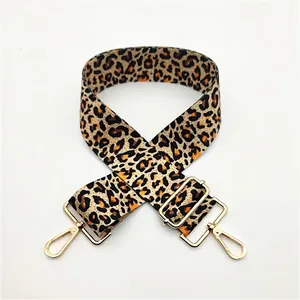 Close-up of leopard print wide replacement bag strap with golden alloy metal buckles