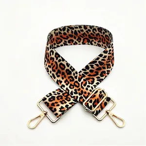 Close-up of leopard print replacement shoulder strap with adjustable golden metal buckles