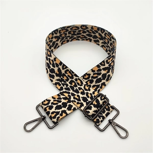 Detail of leopard print wide strap with dark gunmetal swivel lobster clasps and slider