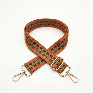 Bandoulière tissée réglable aux motifs géométriques orange et marron avec attaches dorées