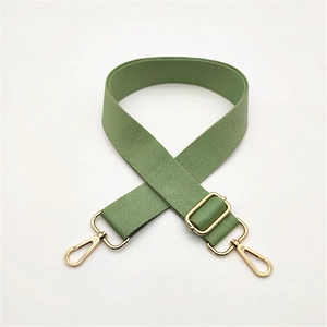 Adjustable grass green canvas bag strap with pale gold metal clasps for crossbody bags