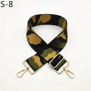 Close-up of camouflage bag strap with adjustable gold metal buckle and lobster clasp