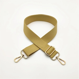 Close-up of adjustable khaki fabric bag strap with premium gold metal swivel hooks