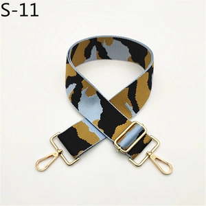 Close-up of adjustable camo shoulder strap with premium golden metal spring hooks