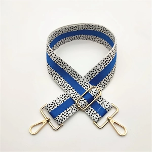 Adjustable wide replacement bag strap with blue and dalmation spot pattern and gold hardware