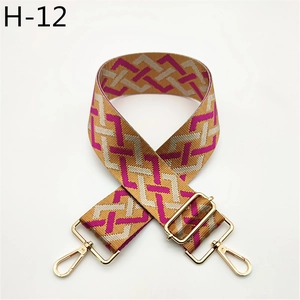 Close-up of adjustable geometric pattern jacquard strap with gold-tone metal hooks