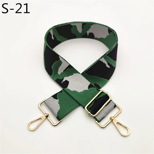 Detail view of camouflage adjustable strap with gold hooks for crossbody handbags