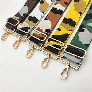Detail view of adjustable camouflage and leopard print wide shoulder straps with gold hooks
