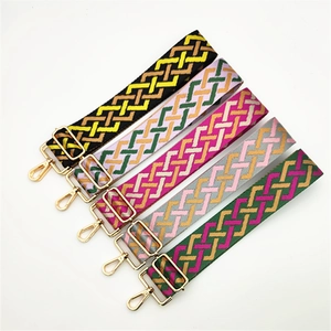 Five assorted colorful woven wide shoulder straps with gold metal buckles and hooks