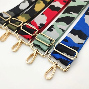 Five assorted camouflage patterns on wide adjustable fabric straps with gold hardware
