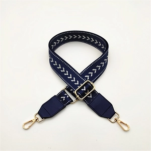 Adjustable wide woven bag strap with white arrow pattern and golden metal buckles