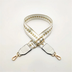 White bag strap with gold chevron embroidery and adjustable metal swivel hooks