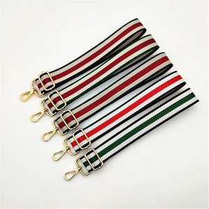 Adjustable striped nylon shoulder strap replacement with gold hardware for handbags