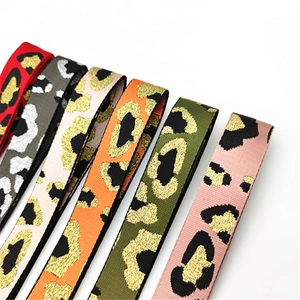 Close-up of adjustable leopard print bag straps in multiple colors with glitter details