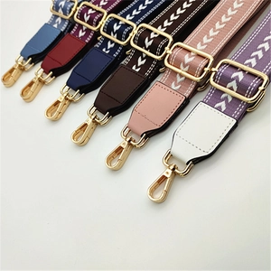 Detail of adjustable woven straps with V-pattern and gold metal buckles in various colors