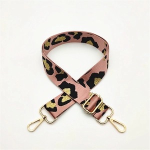 Adjustable leopard print bag strap with pink base and gold metallic clips for cross-body