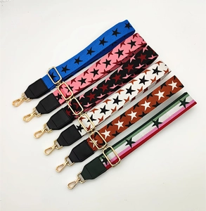 Close-up of adjustable PU leather star pattern shoulder straps with gold metal hooks