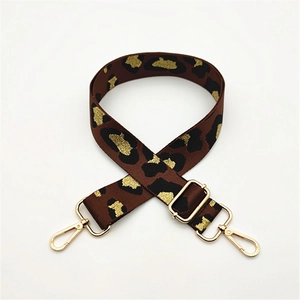 Adjustable leopard print replacement shoulder strap with gold hardware hooks for handbags