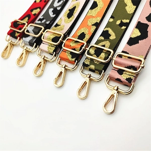 Detail of adjustable leopard print bag straps with gold hardware in multiple colors