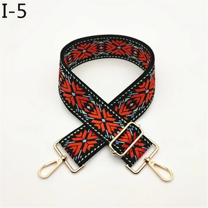 Detail of adjustable geometric ethnic embroidery strap with gold metal lobster clasps