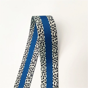 Detailed view of adjustable blue striped shoulder strap with leopard print pattern