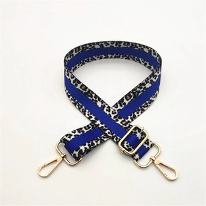 Adjustable leopard print bag strap with royal blue stripe and gold metal hardware