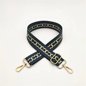 Adjustable dark blue bag strap with gold lobster clasps and geometric chain pattern
