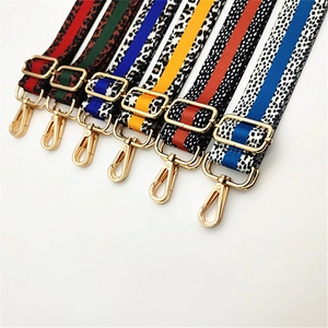 Adjustable leopard print bag strap with colorful stripes and gold metal buckles