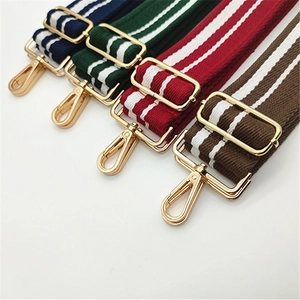 Detail of colorful striped replacement shoulder straps with gold metal hooks and buckles