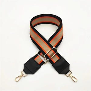 Adjustable striped woven shoulder strap for handbags with gold metal clips and black PU leather