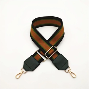 Adjustable striped canvas bag strap with green PU leather ends and gold metal hardware