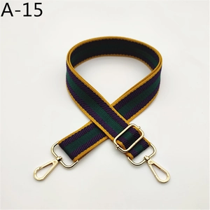Close-up of adjustable striped fabric strap with gold hardware and A-15 serial code