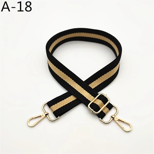 Adjustable black and yellow striped bag strap with gold metal swivel hooks and buckles